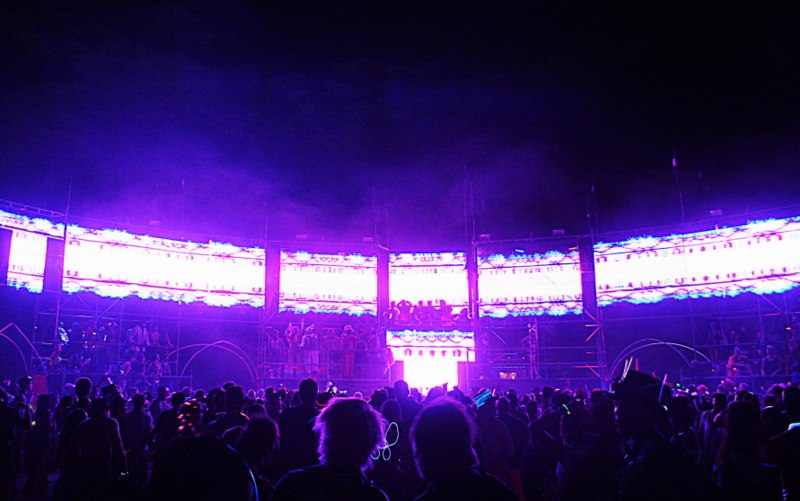 Root Society Arena wide illuminated stage and crowd at Burning Man 2015