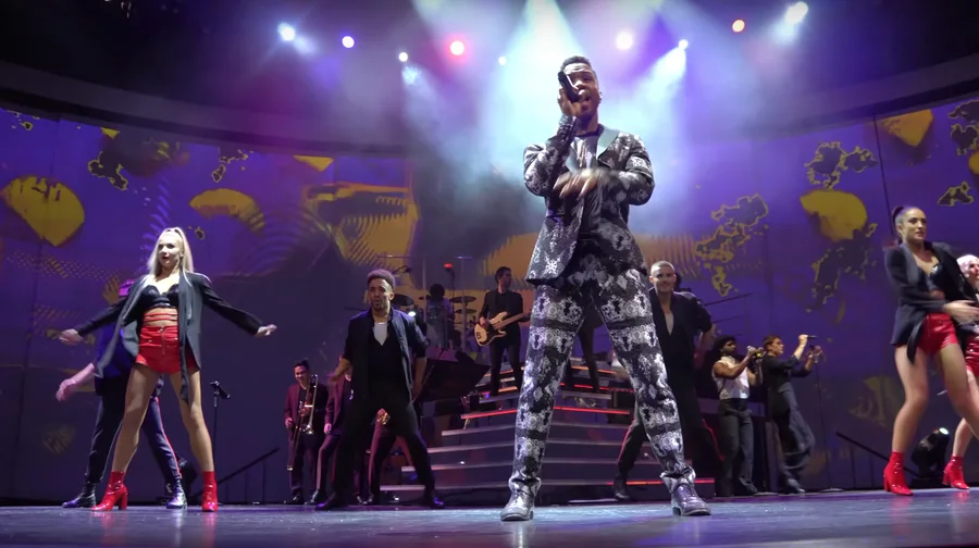 Celebrity Edge live production surrounded by panoramic MELT show visuals