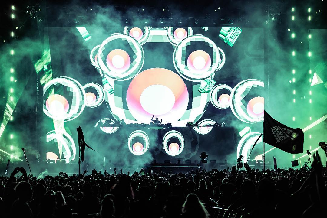 Rusko live visuals framed by festival lighting