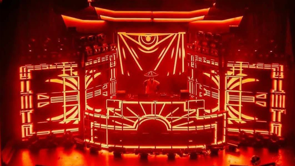 Front view of the Datsik Shogun LED stage glowing red with graphic linework