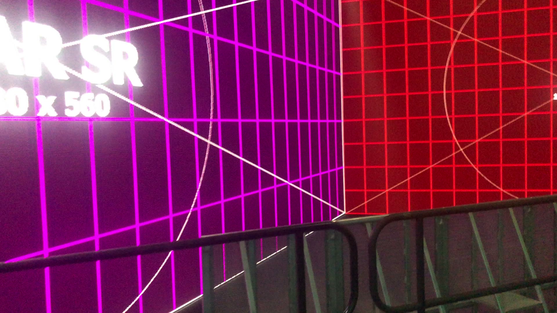 Magenta and red LED wall corner with rear screen label