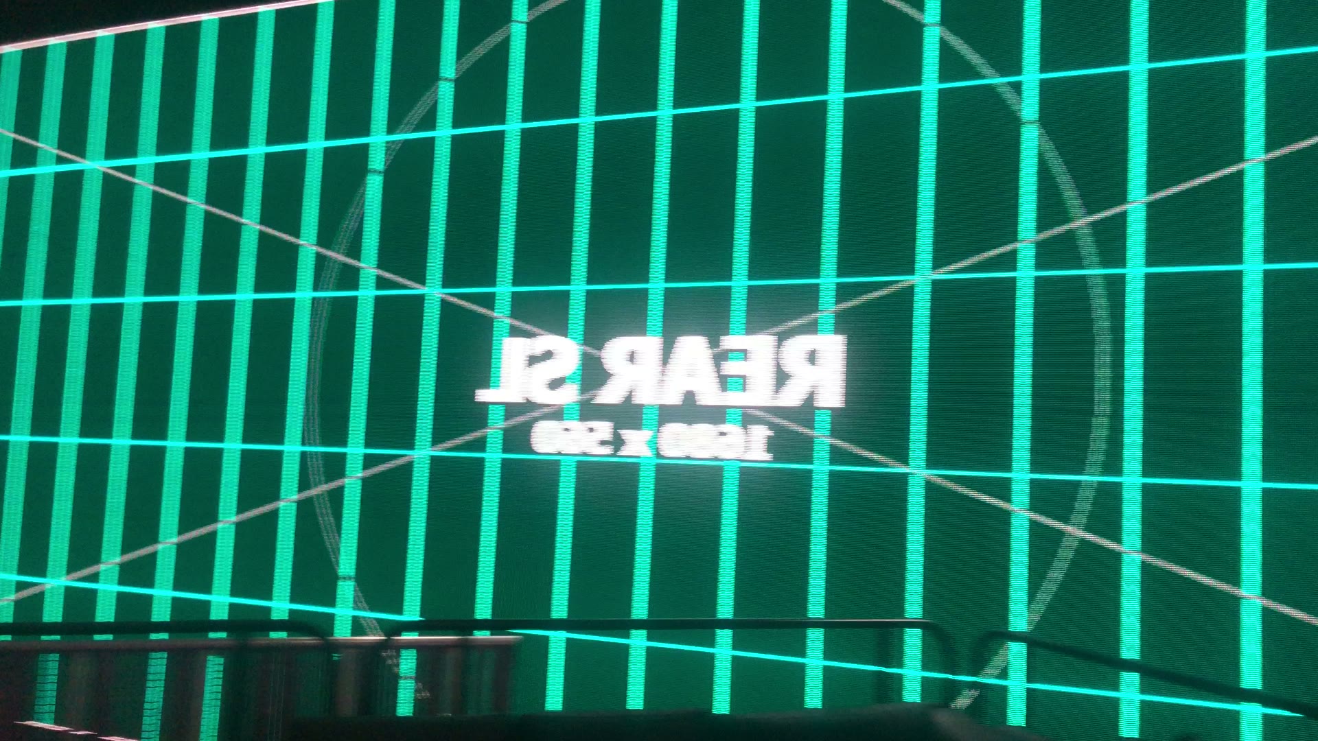 Teal LED wall calibration grid labeled rear screen