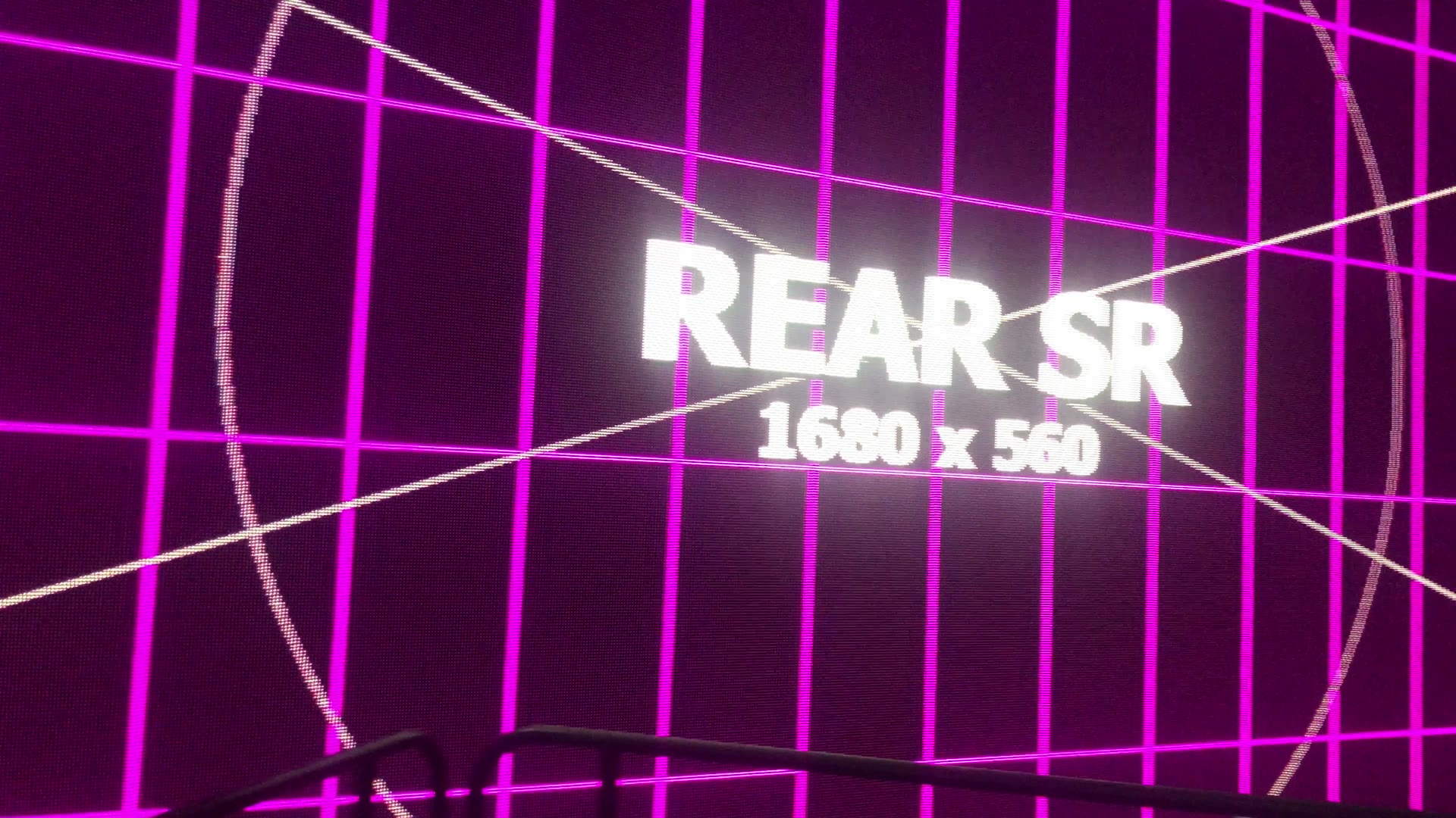 Corner of magenta and red LED wall calibration grids inside The Pentagon