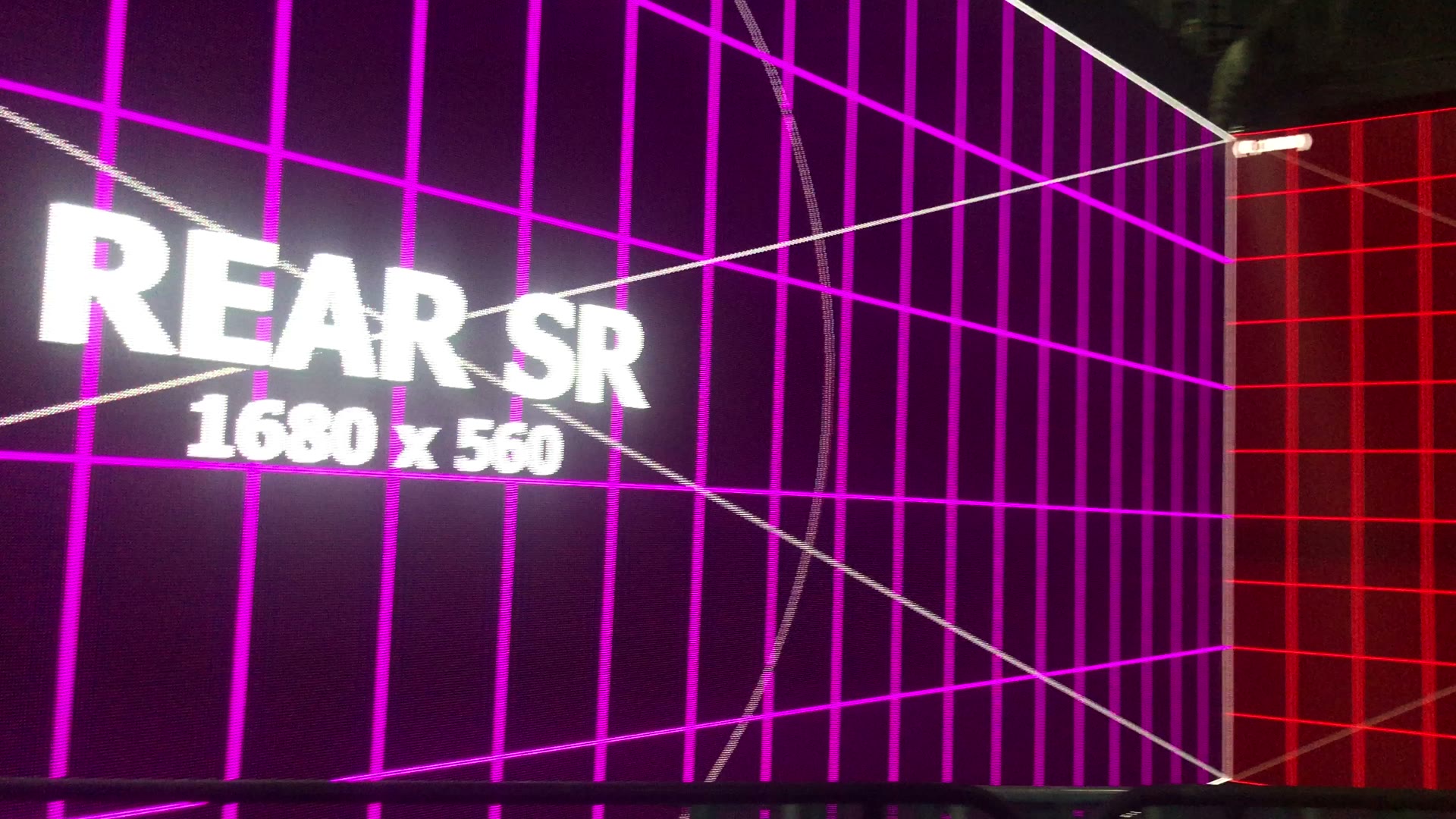 Magenta and red LED wall mapping test around a room corner