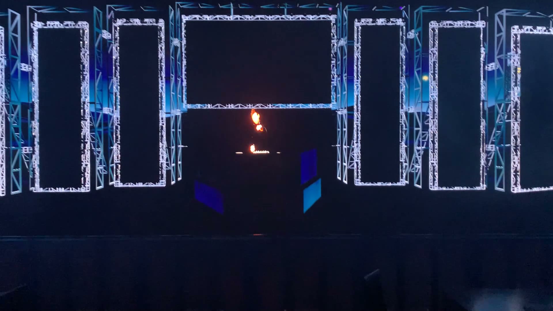 Dark front view of the virtual stage showing the pentagon LED structure outline